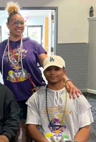 Bianca and son posing together in Seaux Juicy merch