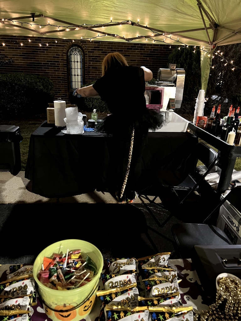 Seaux Juicy Halloween night event setup with string lights and candy