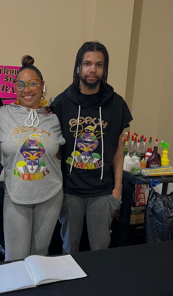 Seaux Juicy team members wearing brand merch at indoor event